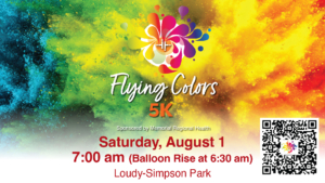 The image is a colorful promotional graphic for the “Flying Colors 5K” sponsored by Memorial Regional Health. Bright clouds of blue, green, yellow, orange, and red powder fill the background around the event logo and title. Event details read: “Saturday, August 1,” “7:00 am (Balloon Rise at 6:30 am),” and “Loudy-Simpson Park.” A QR code for registration appears in the bottom right corner.